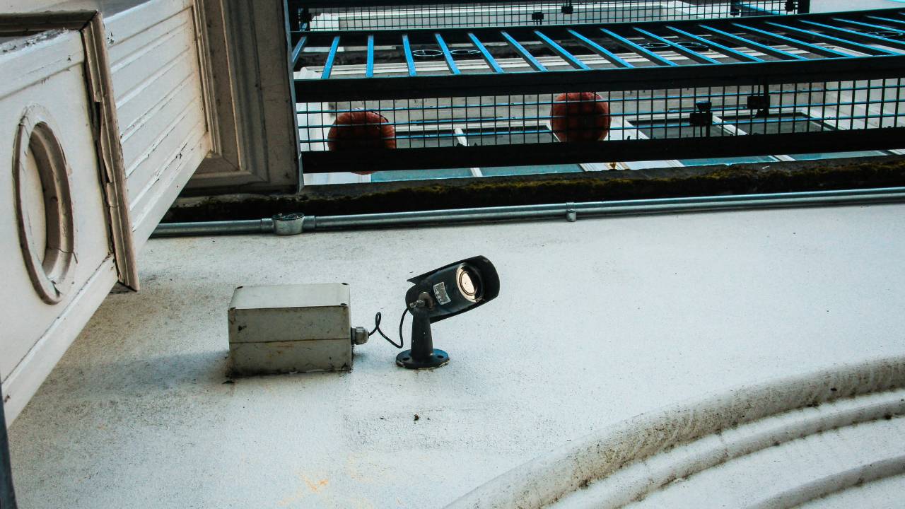 A photo of a CCTV camera mounted on the wall of a hotel